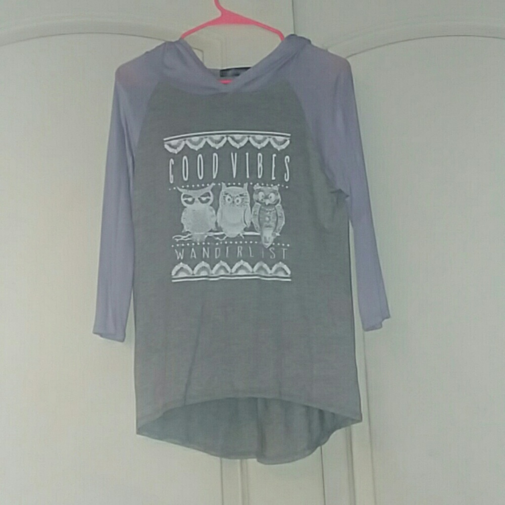 A long, mid sleeve shirt with a hood